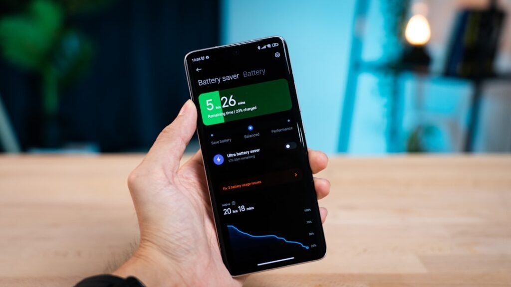 Android smartphone displaying battery saver statistics and usage chart on screen